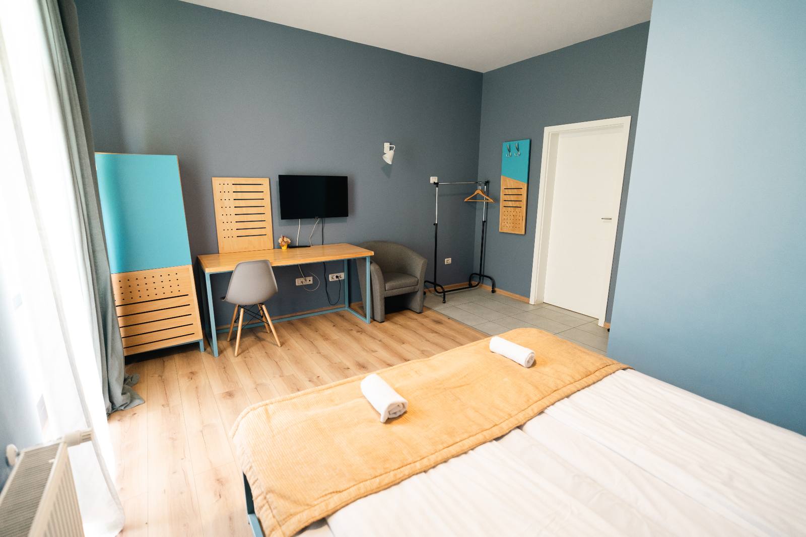 Twin room at Pensiunea Urban Point with two single beds and soft morning light